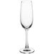 An Acopa Covella flute glass with a stem on a white background.
