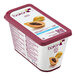 A container of yogurt with Les Vergers Boiron Papaya 100% Fruit Puree and berries.