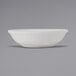 A close-up of a Tuxton TuxTrendz Zion matte white fruit dish.