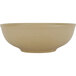 A close up of a Tuxton TuxTrendz Zion matte beige china menudo bowl.