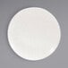 A Front of the House European white porcelain plate with an embossed rim design.