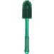 A green Carlisle Sparta multi-purpose cleaning brush with a green handle.