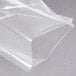 A clear plastic bag of ARY VacMaster chamber vacuum packaging bags on a grey surface.
