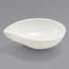 A white Front of the House European white teardrop ramekin on a gray surface.