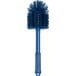 A blue Carlisle Sparta cleaning brush with a handle.