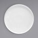 A white Front of the House Soho porcelain plate with a raised white rim on a gray surface.