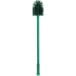 A Carlisle green multi-purpose cleaning brush with a green handle.