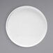 A white Front of the House Soho porcelain plate with a raised rim on a gray background.