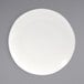 A Front of the House European white porcelain plate with a white rim.