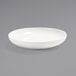 A Front of the House European White porcelain bowl on a gray surface.