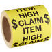 a roll of yellow label with black text