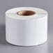 A roll of white Globe E11 labels.