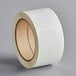 A roll of white paper with white circles.