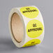 a roll of yellow stickers with black text