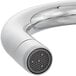 A close up of a chrome Waterloo hands-free sensor faucet with a gooseneck spout.