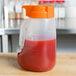 a close up of a container of ketchup