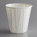 A white Genpak paper souffle cup.