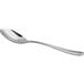 A close-up of an Arcoroc stainless steel spoon with a silver handle.