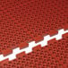 a close-up of a red rubber mat