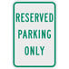 A green and white sign that says "Reserved Parking Only" with white text on a green background.