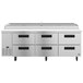 A stainless steel Hoshizaki refrigerated pizza prep table with six drawers.