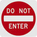 A white rectangular sign with a red and white "Do Not Enter" line and text.