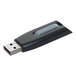 A close-up of a black and grey Verbatim USB flash drive with a logo.