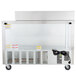 A large silver Beverage-Air refrigerated sandwich prep table on wheels.