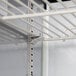A metal shelf with white rods for a Beverage-Air Elite Series Refrigerated Sandwich Prep Table.