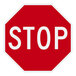 A red and white diamond grade aluminum sign that says "Stop" with white writing.