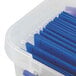 A Bankers Box heavy-duty plastic portable file box with blue folders inside.