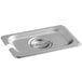 A Carlisle stainless steel slotted hotel pan cover on a stainless steel tray.