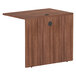 A walnut Alera Valencia return/bridge shell for a desk with a black base.