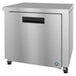 a silver refrigerator with a black handle