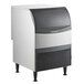 A Scotsman undercounter medium cube ice machine with a black lid and silver finish.