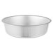 A close-up of a stainless steel Vollrath round bowl.