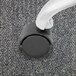 A close-up of a Master Caster Deluxe Duet nylon caster wheel with black and white wheels.