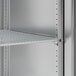 A metal shelf with holes for a Hoshizaki reach-in refrigerator.