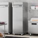 A stainless steel Hoshizaki reach-in refrigerator in a kitchen.