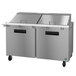 A Hoshizaki stainless steel refrigerated sandwich prep table with two doors.