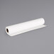 a roll of paper on a gray background