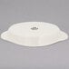 A white Tuxton oval dish with a lid.