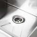 The leg-mounted Advance Tabco stainless steel utility sink with a hole in it.