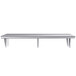 A Regency stainless steel pass-through shelf on a white table.