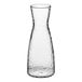 A clear plastic carafe with a curved neck.