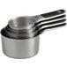 A stack of OXO stainless steel magnetic measuring cups.