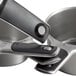 A close-up of the OXO Good Grips 4-piece stainless steel measuring cup set on a counter.