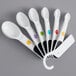 a close up of white utensils