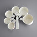 A white OXO measuring cup set with 7 pieces.