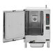 A Cleveland SteamChef countertop convection steamer with a door open and trays inside.